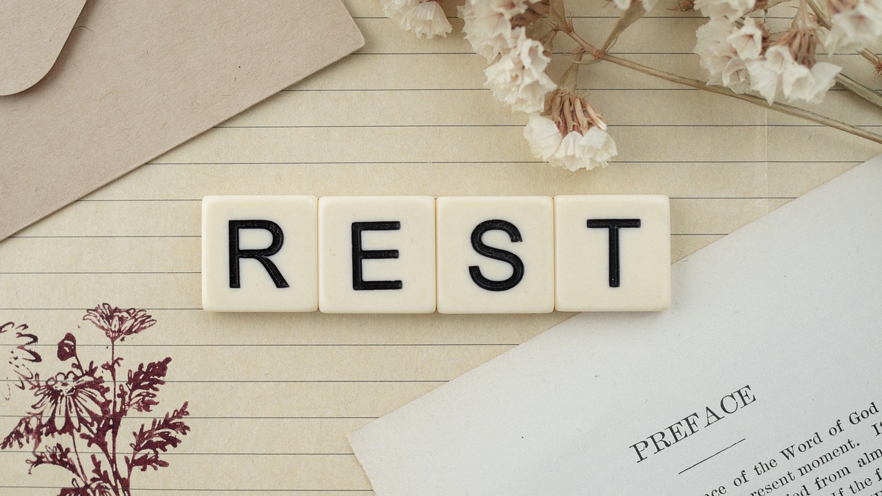 Rest spelled out in blocks in a calming beautiful scene